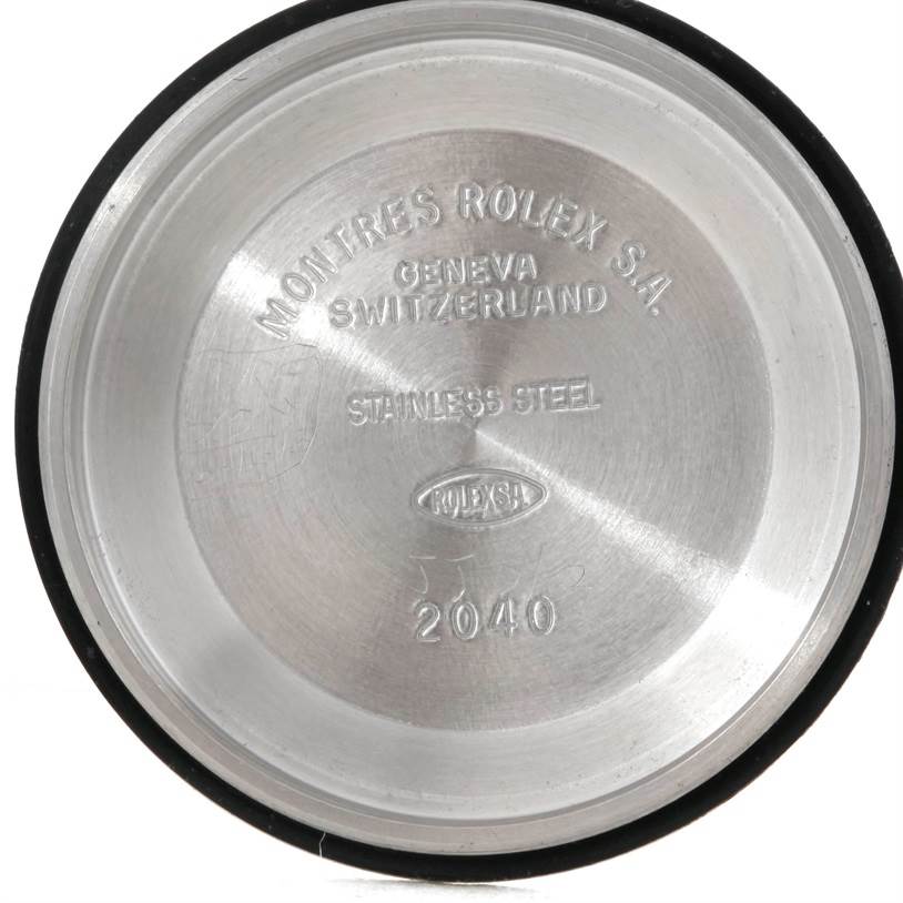 This image shows the inside of the case back of a Mid-Size Rolex watch, displaying model and brand engravings.