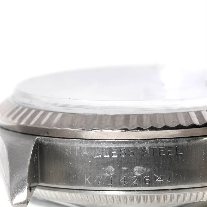 This image shows a close-up, side view of a stainless steel Rolex Mid-Size 78274 Women's Stainless Steel Mother of Pearl Dial 78274 Women's Stainless Steel Mother of Pearl Dial model watch, highlighting the case with visible serial number.
