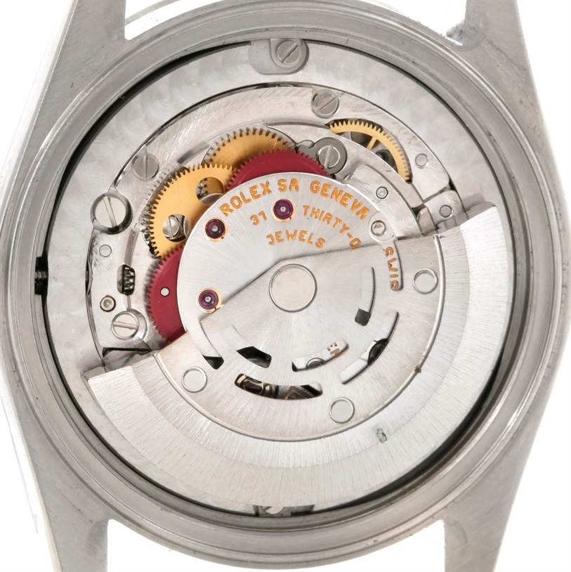 This image shows the rear view of a Rolex Mid-Size 78274 Women's Stainless Steel Mother of Pearl Dial 78274 Women's Stainless Steel Mother of Pearl Dial watch's internal mechanism, highlighting its gears and jewels.