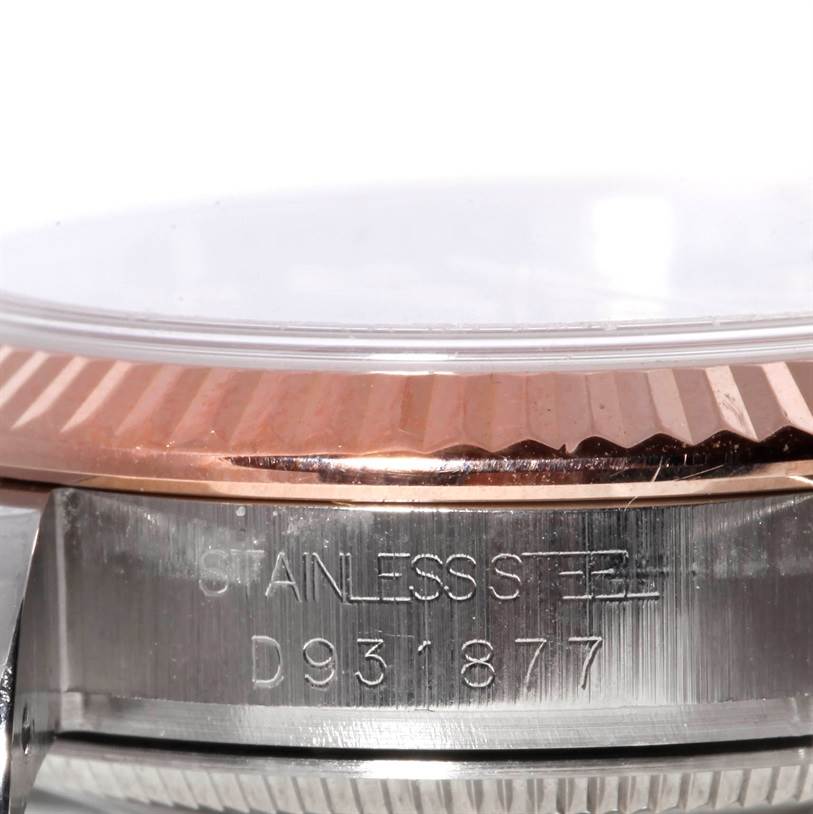 The image shows a close-up side view of a Rolex Mid-Size 178271 Women's Steel and Gold (two tone) Black Dial 178271 Women's Steel and Gold (two tone) Black Dial model's stainless steel case and fluted bezel.