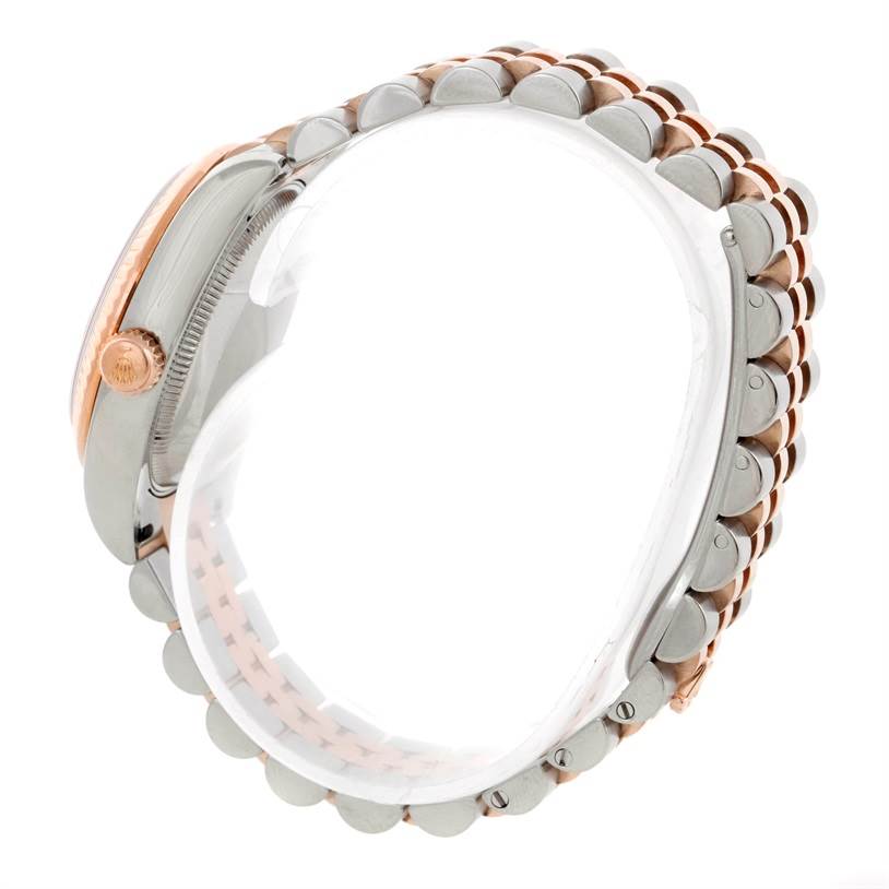 The image shows a side view of a Mid-Size Rolex watch highlighting its crown, case, and two-tone metal bracelet.