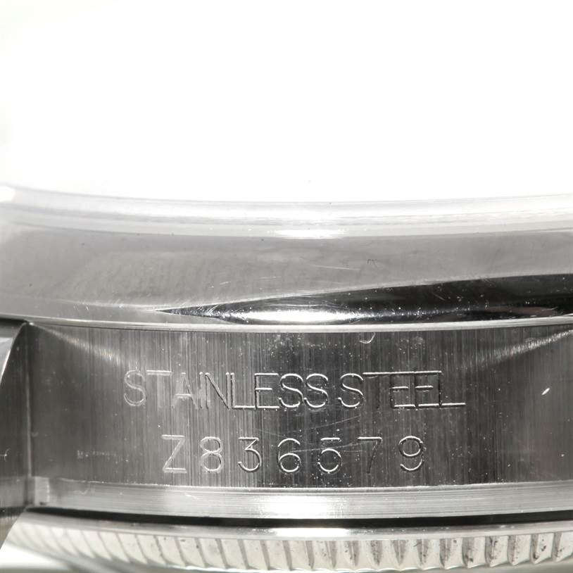 The image shows a close-up of the stainless steel case side of a Rolex Mid-Size 178240 Men's Stainless Steel White Dial 178240 Men's Stainless Steel White Dial model watch, including the serial number.