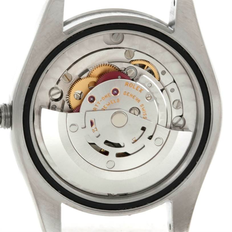 The image shows the internal mechanism of a Rolex Mid-Size 178240 Men's Stainless Steel White Dial 178240 Men's Stainless Steel White Dial model watch from the back angle.