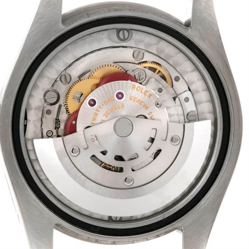 This image shows the internal mechanism and movement of a Rolex Mid-Size 178344 Women's Stainless Steel Silver Dial 178344 Women's Stainless Steel Silver Dial watch, viewed from the back.