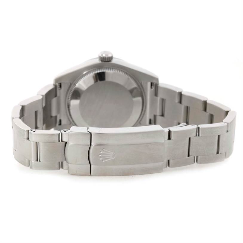 The image shows the back view of a Mid-Size Rolex watch, including the case back and bracelet clasp.