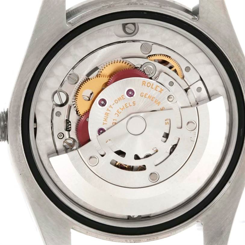 The image displays the inner mechanism and movement of a Rolex Mid-Size 177200 Women's Stainless Steel Pink Dial 177200 Women's Stainless Steel Pink Dial watch from a rear angle.