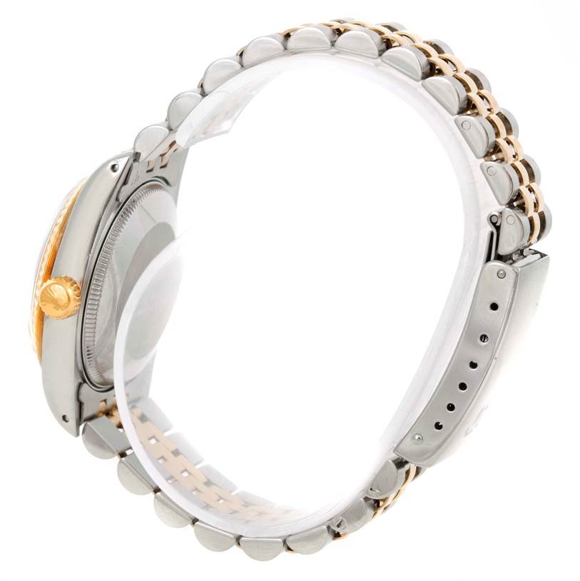 The image shows a side view of the Rolex Mid-Size 68273 Women's Steel and Gold (two tone) Beige Dial 68273 Women's Steel and Gold (two tone) Beige Dial model watch, highlighting the case, crown, and part of its two-tone bracelet.