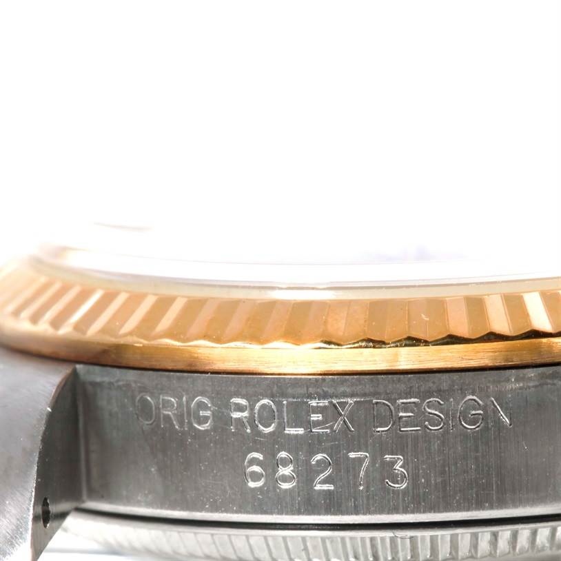 This image shows a close-up side view of the bezel and case of a Mid-Size Rolex watch, displaying the model number 68273.