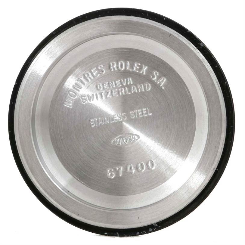 This is the back case of a Mid-Size Rolex watch, showing the engravings and detailing of the model number 67400.