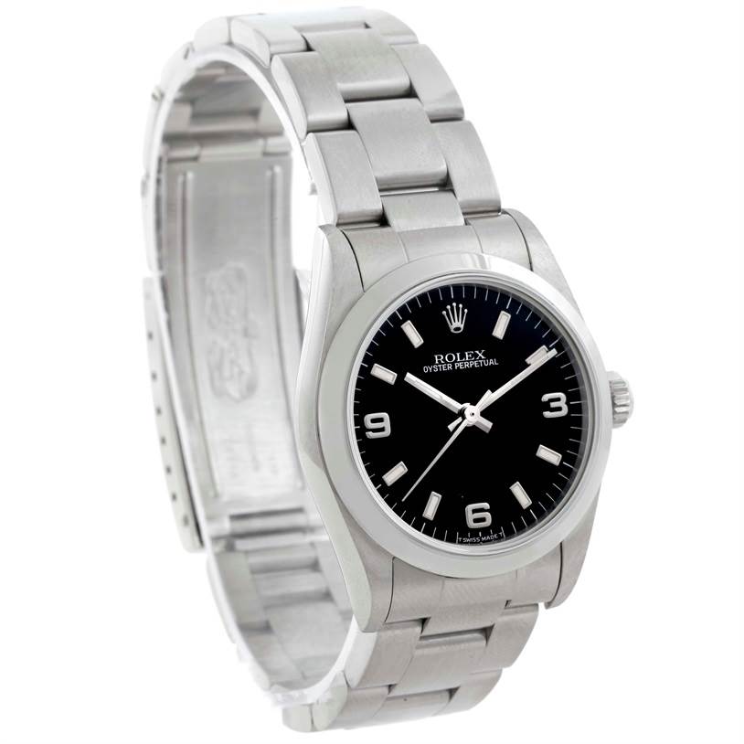 This Rolex Mid-Size 67480 Women's Stainless Steel Black Dial 67480 Women's Stainless Steel Black Dial watch is shown from a three-quarter angle, highlighting the black dial, hour markers, hands, and stainless steel bracelet.