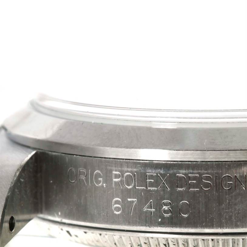This image shows a close-up of the case side and bezel of a Mid-Size Rolex watch, displaying the engraved model number "67480."