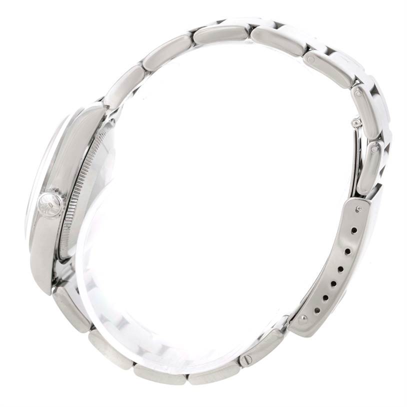 The image shows a side profile of a Mid-Size Rolex watch focusing on the bracelet, clasp, and side of the case.