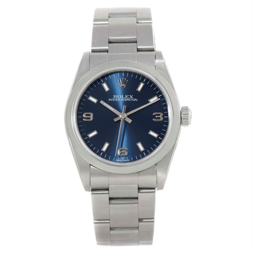 The image shows a front view of a Mid-Size Rolex Oyster Perpetual watch, highlighting its blue dial and stainless steel bracelet.