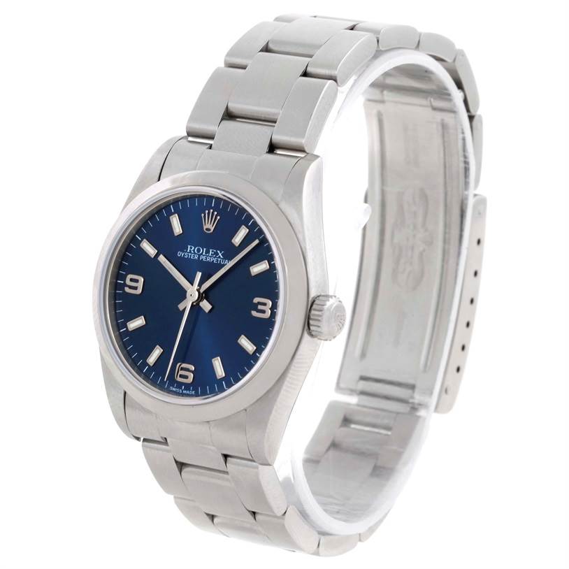 The Rolex Mid-Size 77080 Women's Stainless Steel Blue Dial 77080 Women's Stainless Steel Blue Dial Oyster Perpetual watch is shown at a front angle with a focus on the dial, bezel, and bracelet.