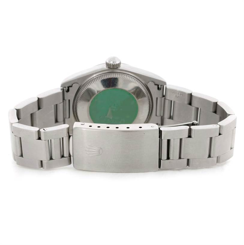This image shows the back view of a Mid-Size Rolex watch, including the bracelet and clasp.