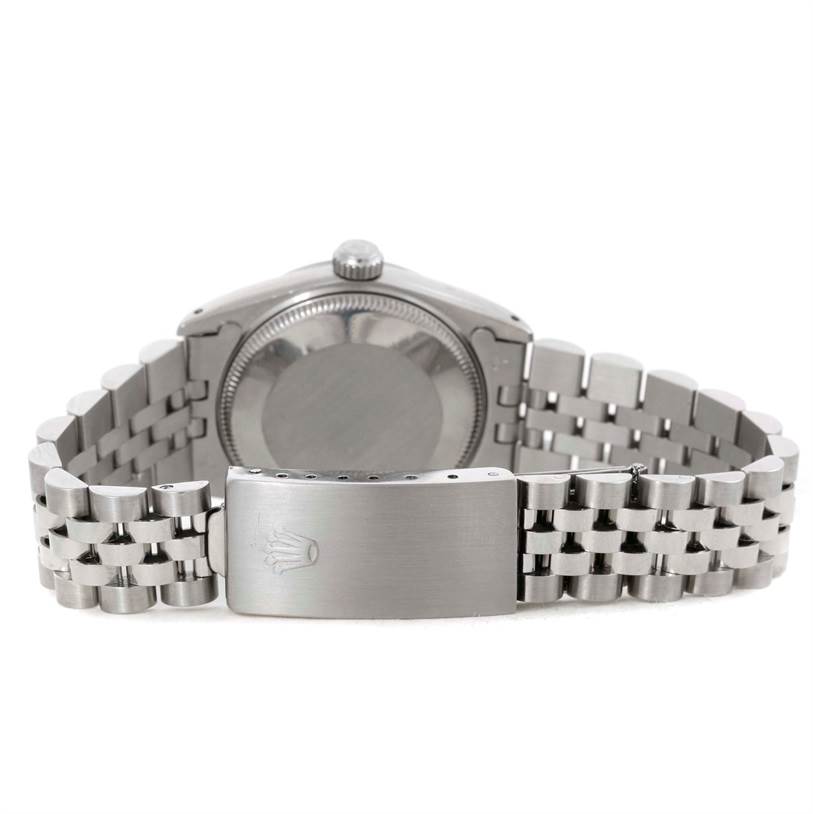 This image shows the back case and closed clasp of a Rolex Mid-Size 67480 Women's Stainless Steel Black Dial 67480 Women's Stainless Steel Black Dial model, displaying the bracelet and crown logo on the clasp.
