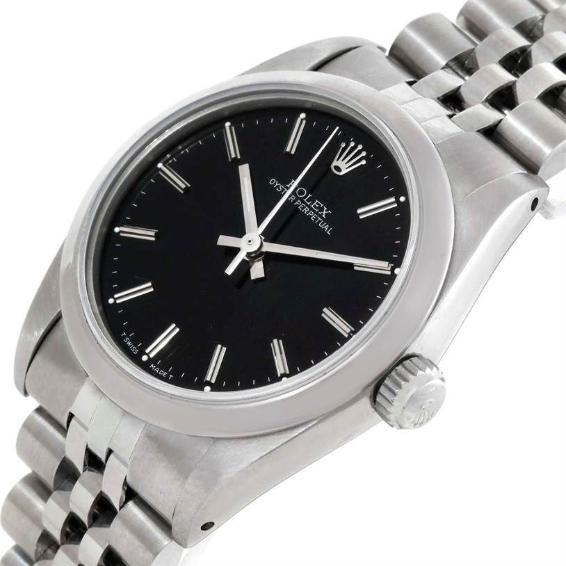 The image shows a Rolex Mid-Size 67480 Women's Stainless Steel Black Dial 67480 Women's Stainless Steel Black Dial Oyster Perpetual watch at an angled close-up, displaying its black dial, bezel, crown, and part of the bracelet.