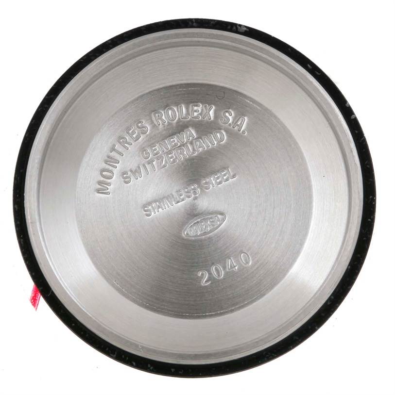 This image shows the interior case back of a Mid-Size Rolex watch, displaying engravings including the brand and model details.