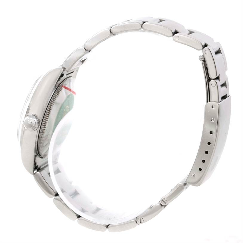 This image shows a side view of a Mid-Size Rolex watch, highlighting the case, bracelet, and clasp.