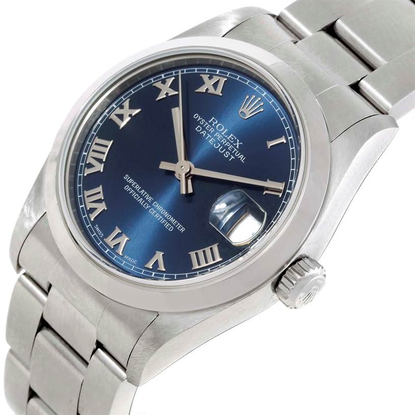 The image shows a Rolex Mid-Size 68240 Women's Stainless Steel Blue Dial 68240 Women's Stainless Steel Blue Dial Datejust watch from an angled side view, highlighting the dial, bezel, crown, and bracelet.