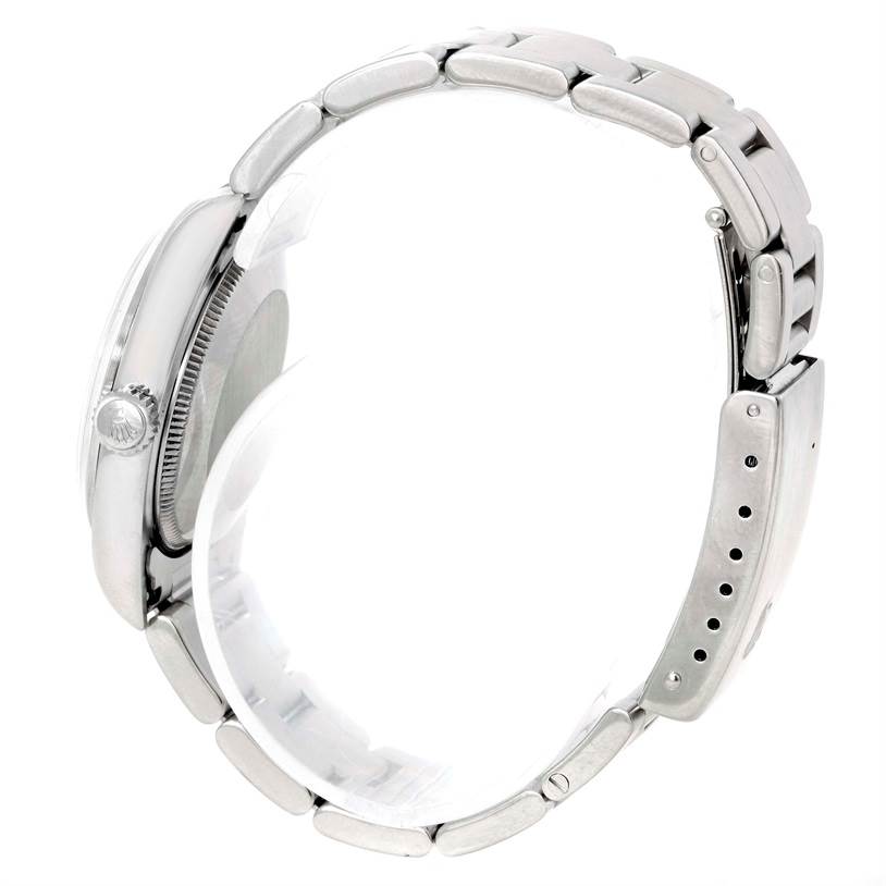 The image shows a side profile view of the Rolex Mid-Size 77080 Women's Stainless Steel Pink Dial 77080 Women's Stainless Steel Pink Dial model, focusing on the bracelet, clasp, and crown.