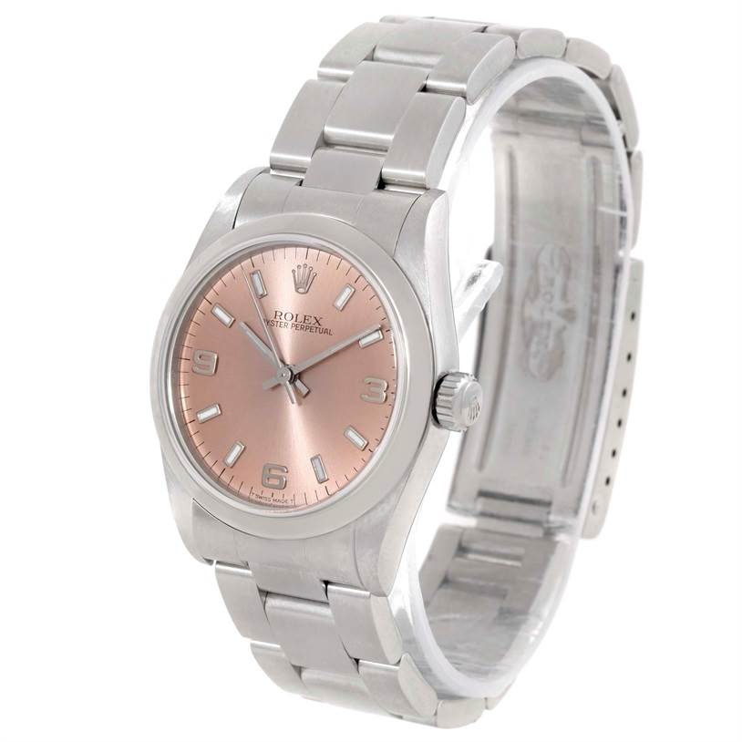 The Mid-Size Rolex watch is shown at a three-quarter angle, displaying the dial, bezel, bracelet, and partially visible crown.