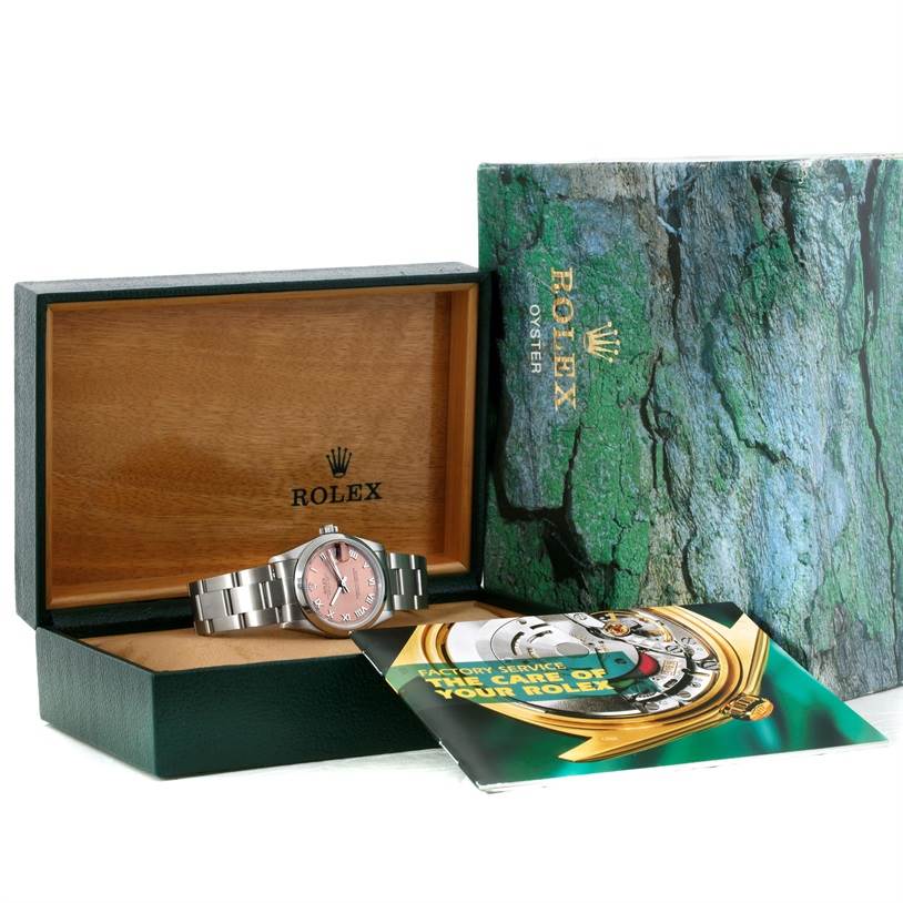 The image shows a Mid-Size Rolex watch in its box, along with the outer packaging and a maintenance booklet.