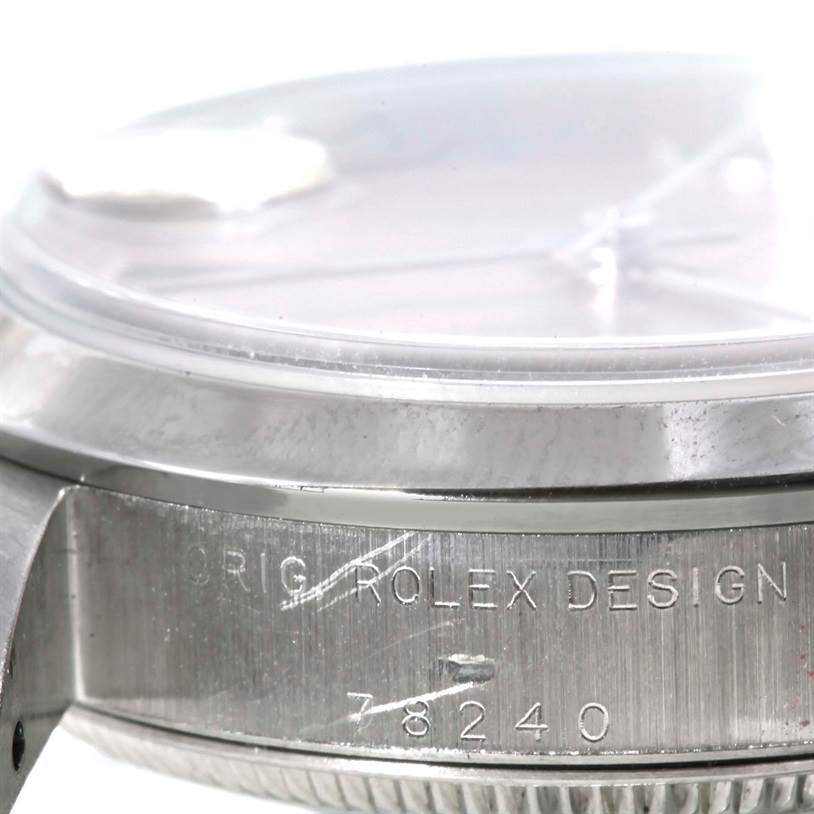 This image shows a close-up of the side of the mid-sized Rolex watch case, featuring the engraved design and model number 78240.