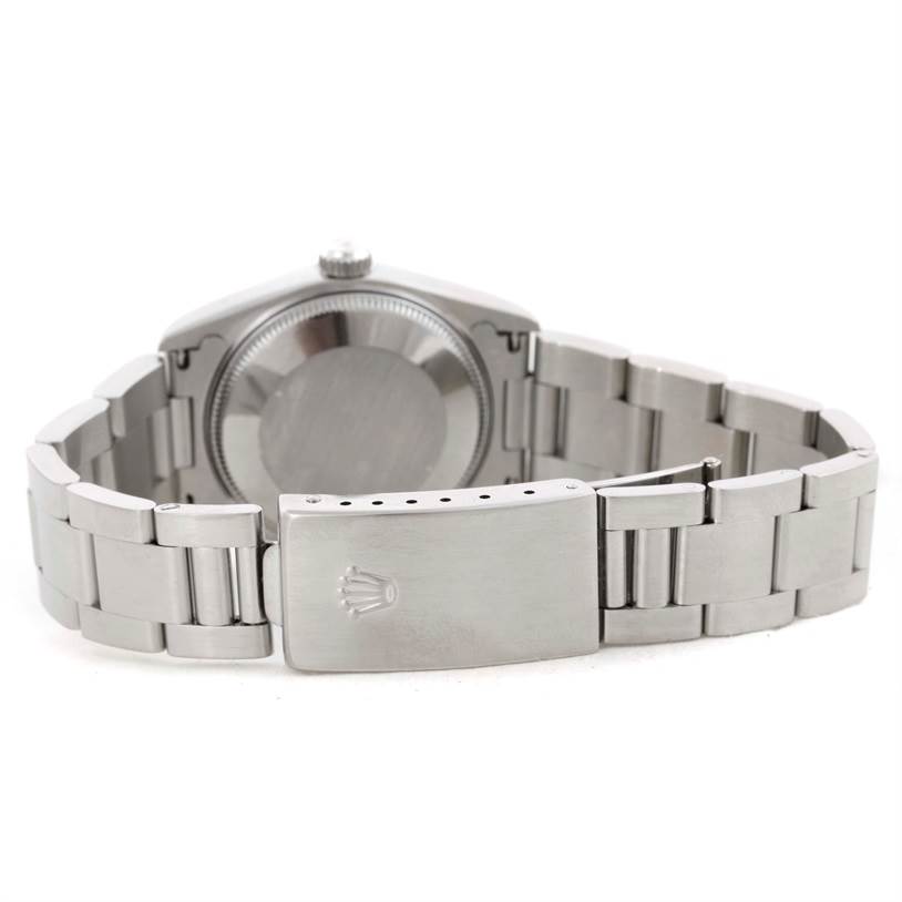 The image shows the back view of a Mid-Size Rolex watch with an open stainless steel bracelet and clasp.