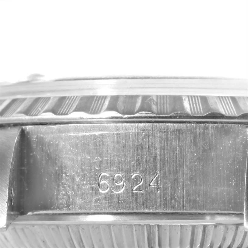 This close-up image shows the side of the casing of a Rolex Date 6924 Women's Stainless Steel Silver Dial 6924 Women's Stainless Steel Silver Dial model watch, highlighting the reference number "6924" and the edge of the bezel.