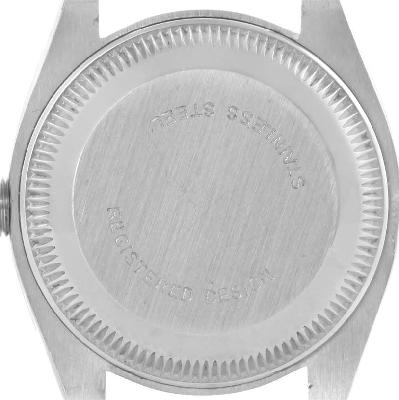The image shows the case back of a Rolex Date 6924 Women's Stainless Steel Silver Dial 6924 Women's Stainless Steel Silver Dial model watch taken from a straight-on angle.