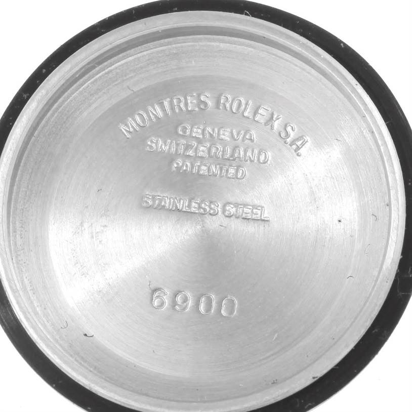 This image shows the inside case back of a Rolex Date 6924 Women's Stainless Steel Silver Dial 6924 Women's Stainless Steel Silver Dial model, highlighting the engravings and material information.