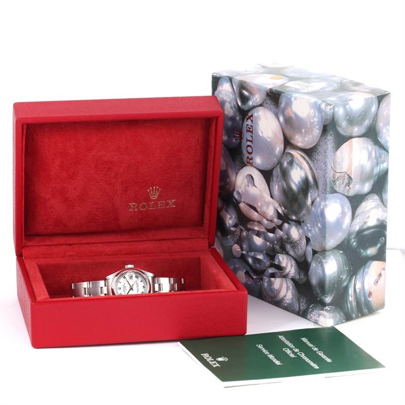 The Rolex Date 79160 Women's Stainless Steel White Dial 79160 Women's Stainless Steel White Dial watch is shown in an open red box, accompanied by its outer packaging and paperwork.