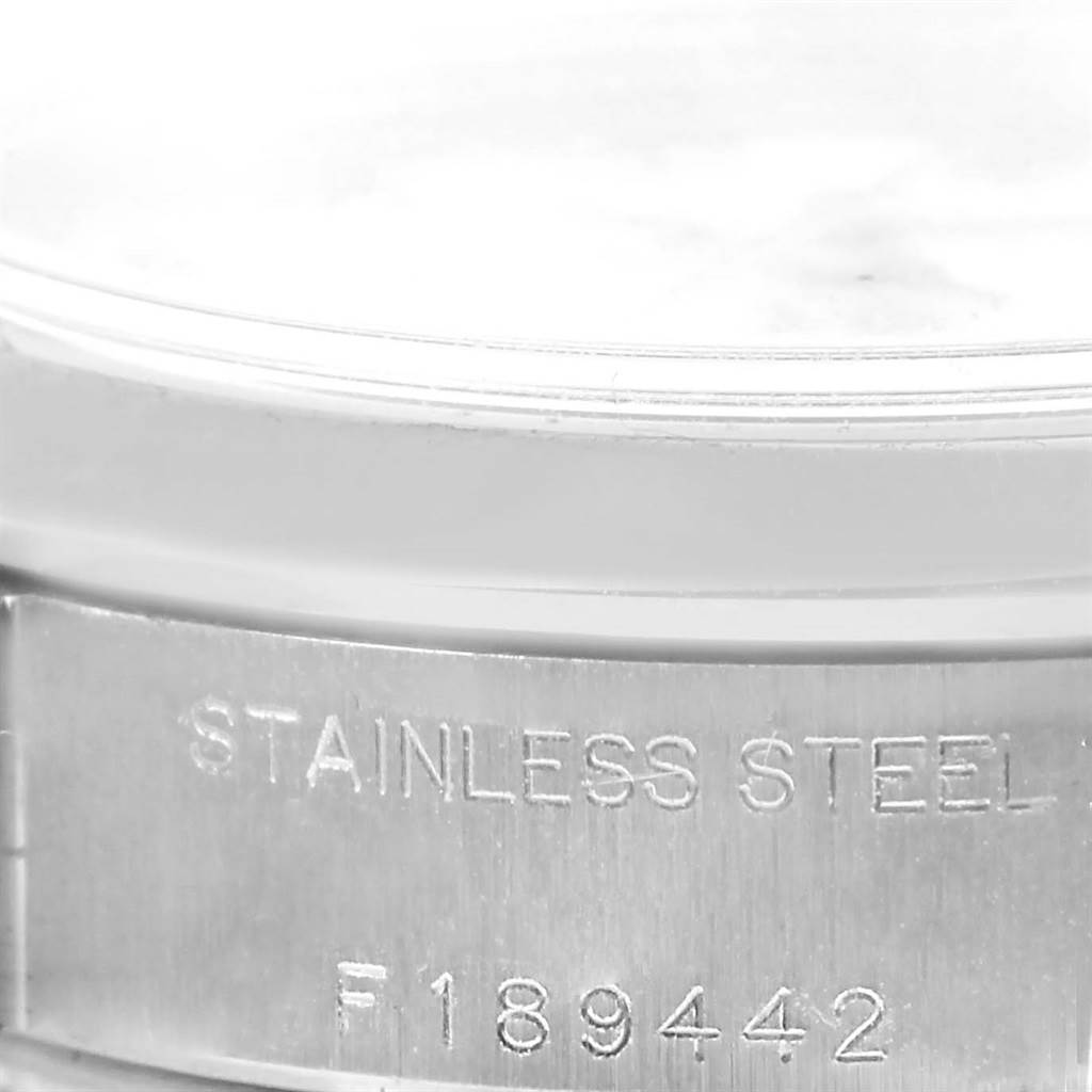 The image shows a close-up of the side of a Rolex Date 79160 Women's Stainless Steel White Dial 79160 Women's Stainless Steel White Dial model, featuring the case and part of the bracelet with "STAINLESS STEEL" engraved.