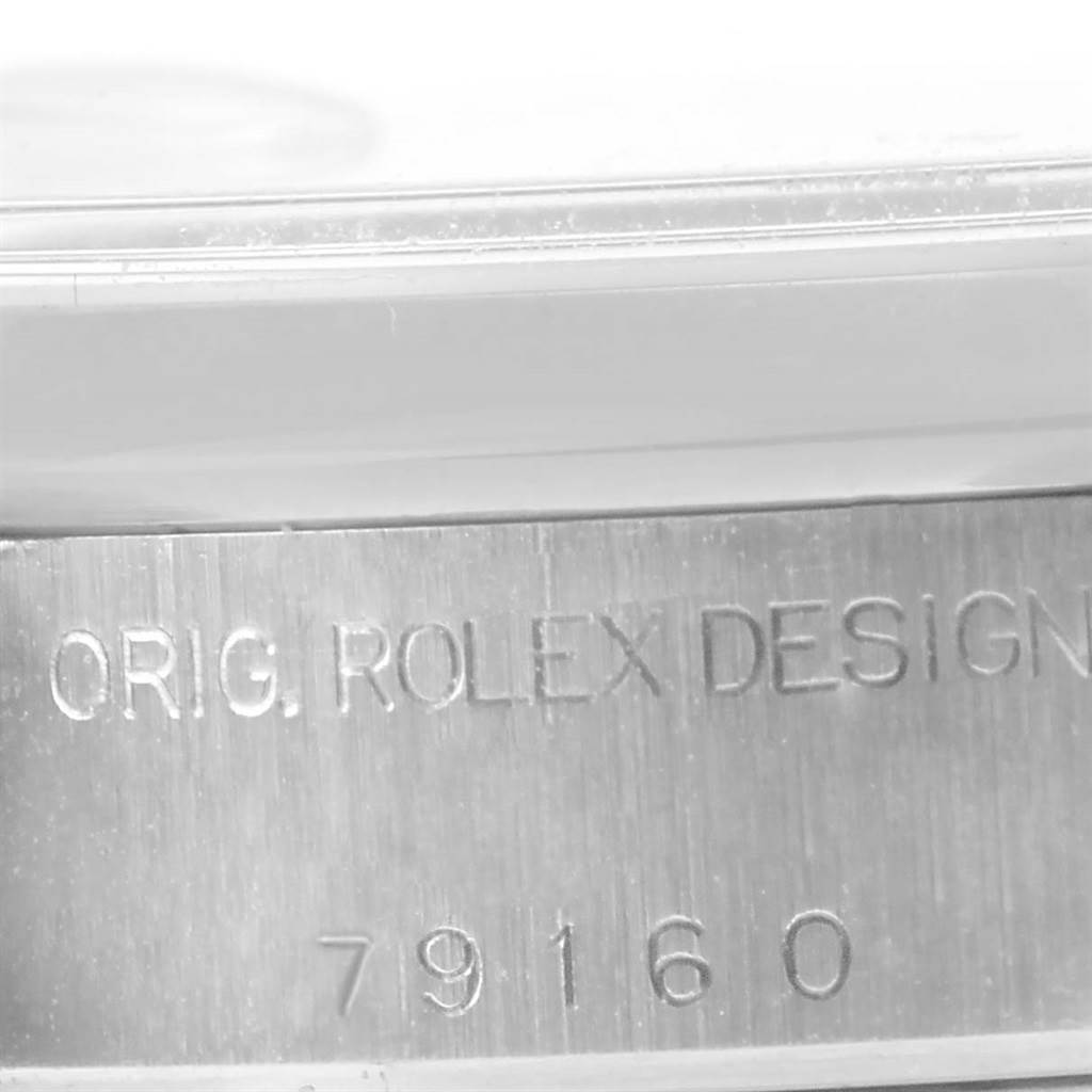This image shows a close-up of the case side engraving on a Rolex Date 79160 Women's Stainless Steel White Dial 79160 Women's Stainless Steel White Dial model, displaying "ORIG. ROLEX DESIGN" and the model number "79160".