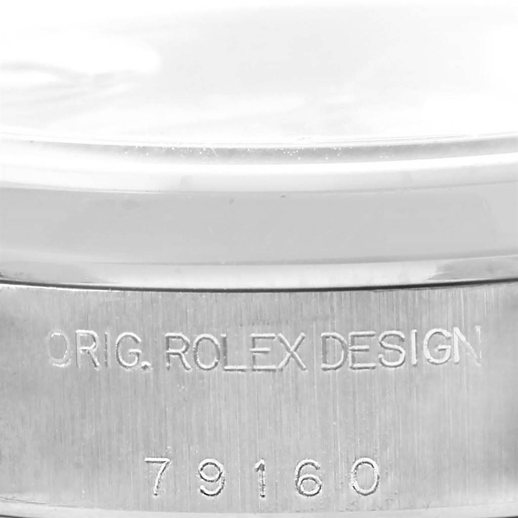 The image shows the side of the Rolex Date 79160 Women's Stainless Steel White Dial 79160 Women's Stainless Steel White Dial watch, highlighting the engraving "ORIG. ROLEX DESIGN" and model number "79160".