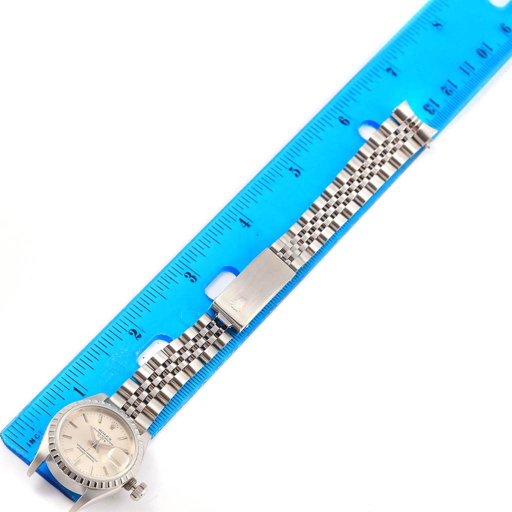 The image shows a Rolex Date 69240 Women's Stainless Steel Silver Dial 69240 Women's Stainless Steel Silver Dial watch laid flat with the face, crown, and Jubilee bracelet visible, measured against a ruler.