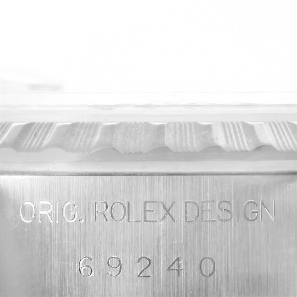 This image shows the side view of the Rolex Date 69240 Women's Stainless Steel Silver Dial 69240 Women's Stainless Steel Silver Dial model, displaying the model number 69240 and the engraved "ORIG. ROLEX DESIGN."