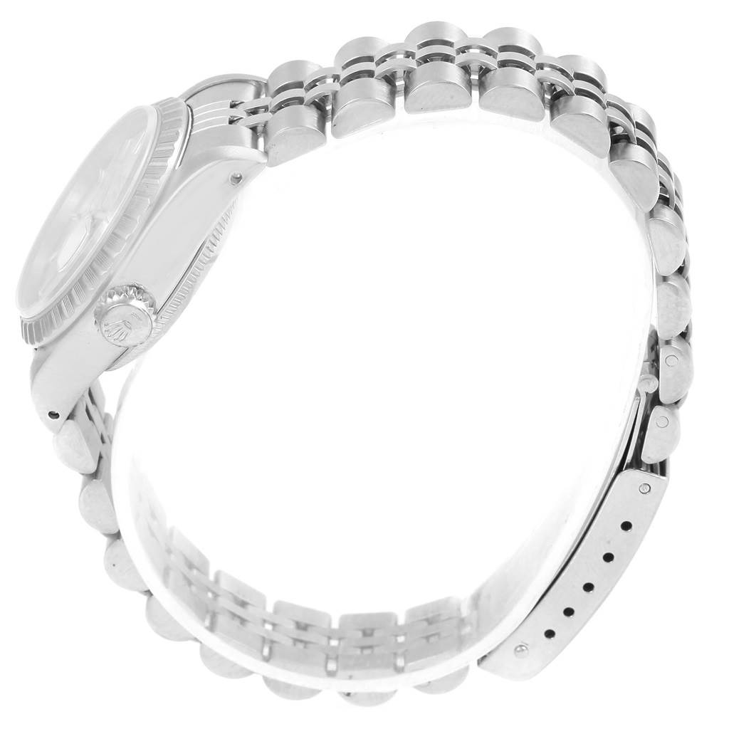 The Rolex Date 69240 Women's Stainless Steel Silver Dial 69240 Women's Stainless Steel Silver Dial model watch is shown from a side angle, highlighting the crown, case, and bracelet.