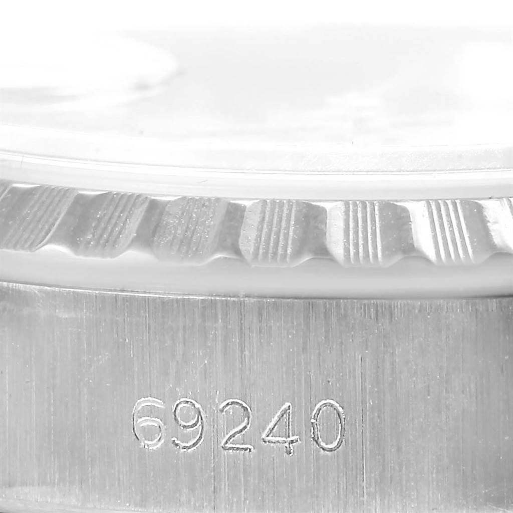 This close-up image shows the case and bezel of the Rolex Date 69240 Women's Stainless Steel Silver Dial 69240 Women's Stainless Steel Silver Dial model watch, displaying the engraved model number "69240."
