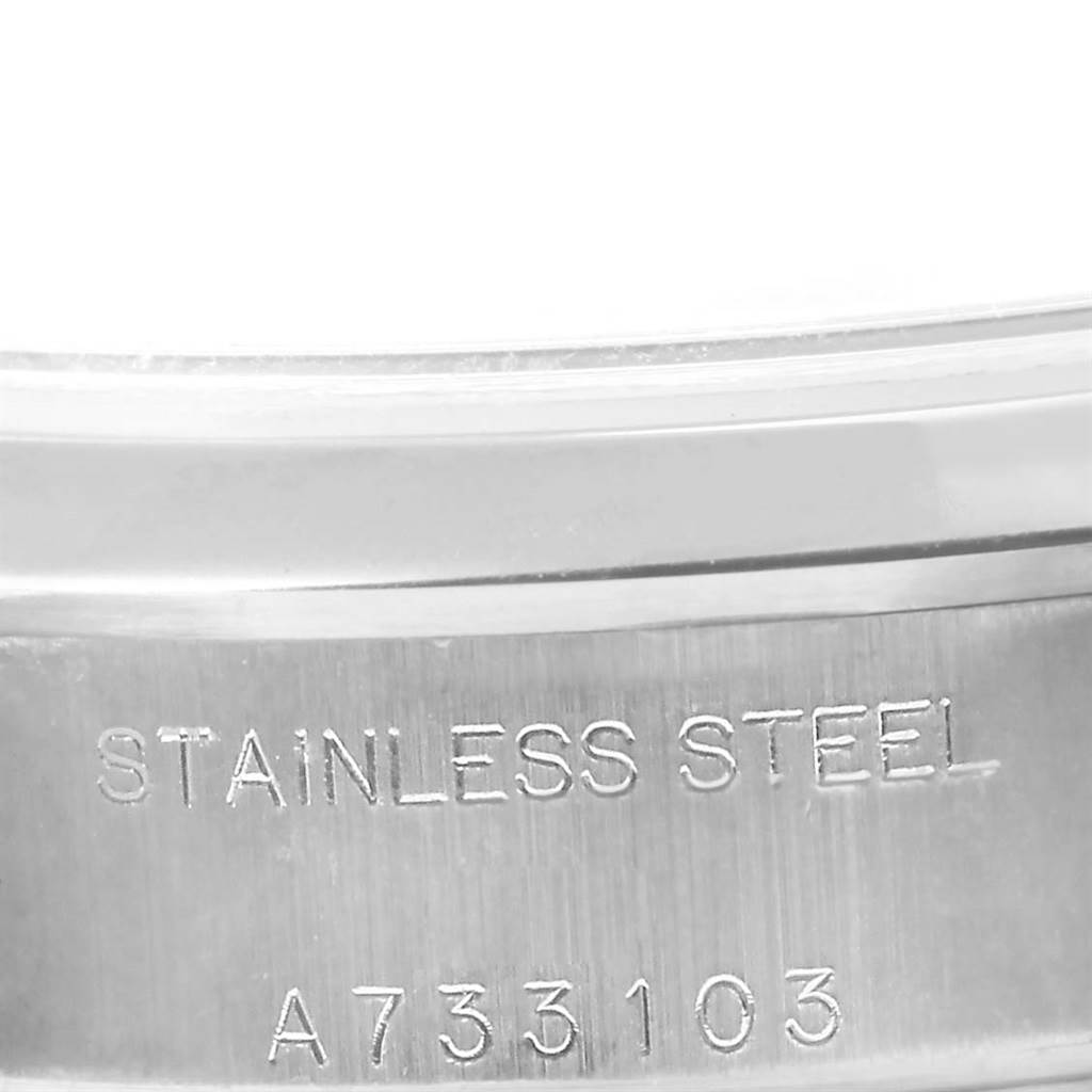 This image shows a close-up of the Rolex Date 79160 Women's Stainless Steel Blue Dial 79160 Women's Stainless Steel Blue Dial model's stainless steel band with its serial number engraved.