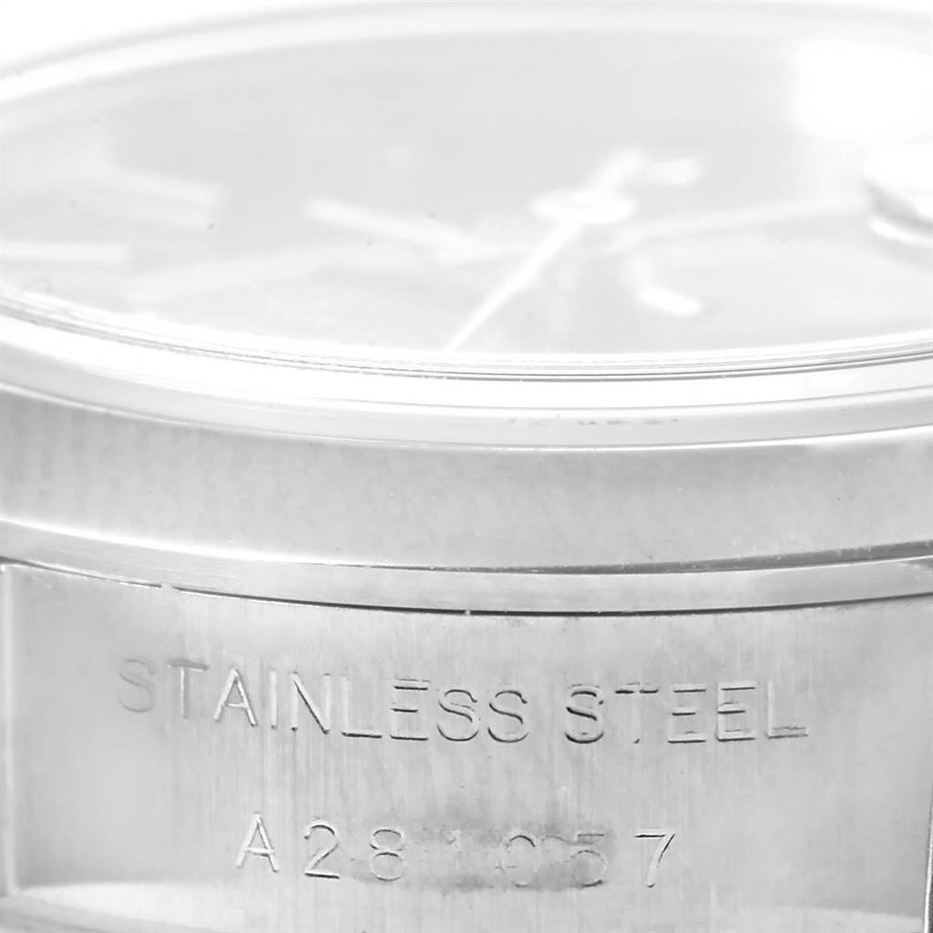 This close-up image of the Rolex Date 79160 Women's Stainless Steel Black Dial 79160 Women's Stainless Steel Black Dial watch shows the side of the stainless steel case with its serial number.