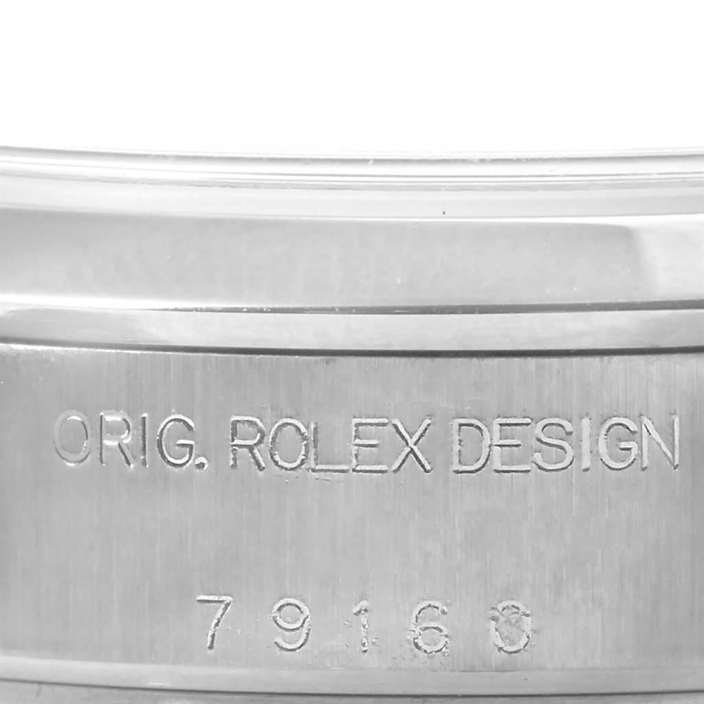 This is a close-up of the engraved bezel from a Date model Rolex watch, displaying the "ORIG. ROLEX DESIGN" text and model number 79160.