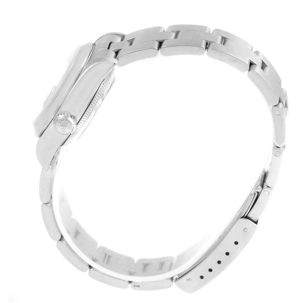 This side profile of the Rolex Date 69160 Women's Stainless Steel Pink Dial 69160 Women's Stainless Steel Pink Dial model shows the case, crown, and bracelet.