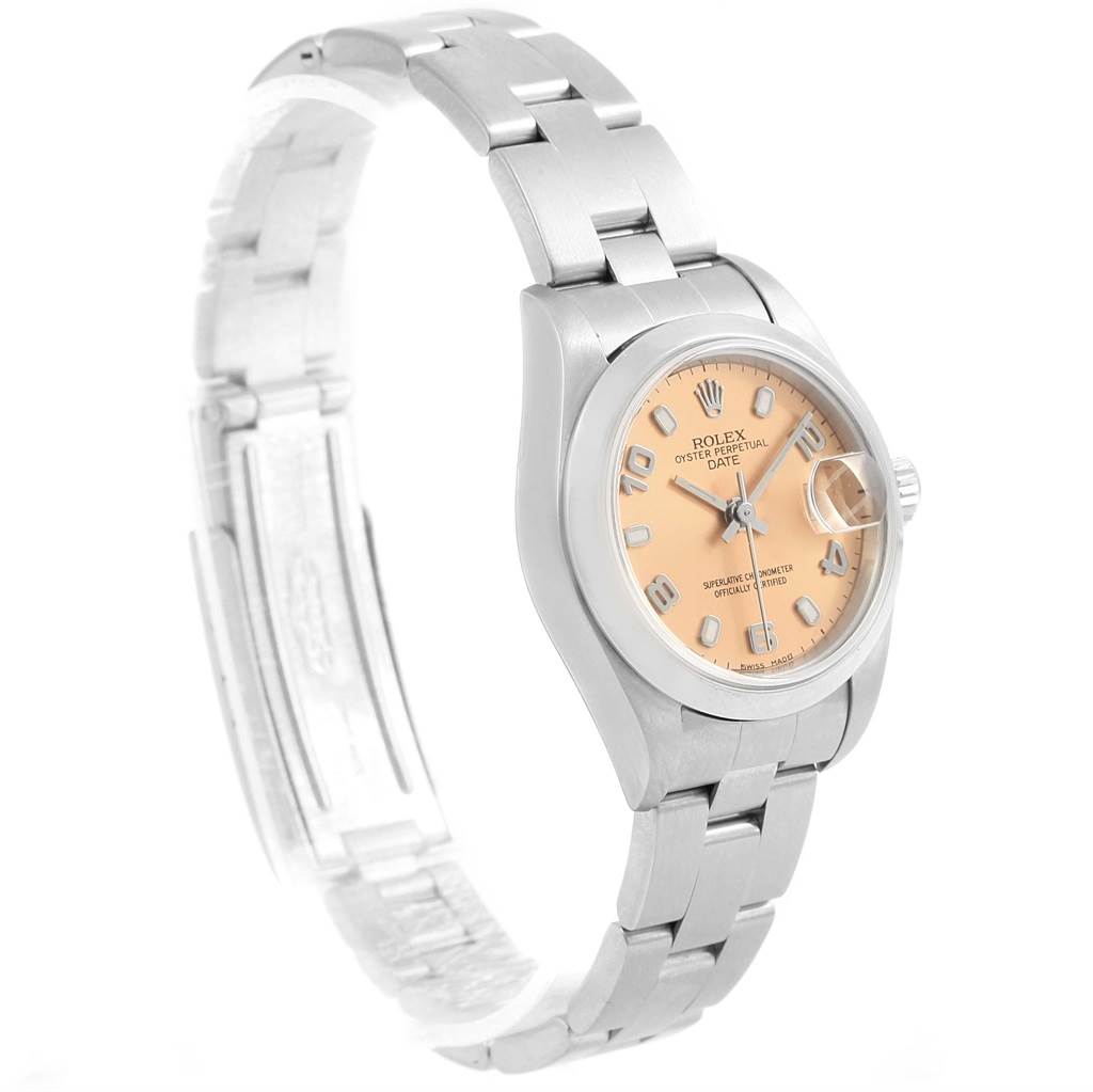 The image shows a side angle of a Rolex Oyster Perpetual Date watch, highlighting its bracelet, dial, and clasp.