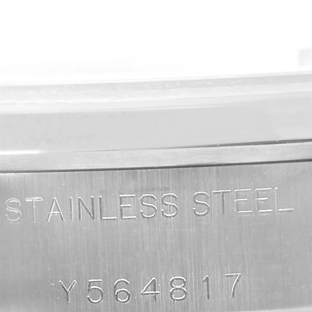 The image shows a close-up of the stainless steel casing with the serial number of a Rolex Date 79160 Women's Stainless Steel Pink Dial 79160 Women's Stainless Steel Pink Dial model watch.