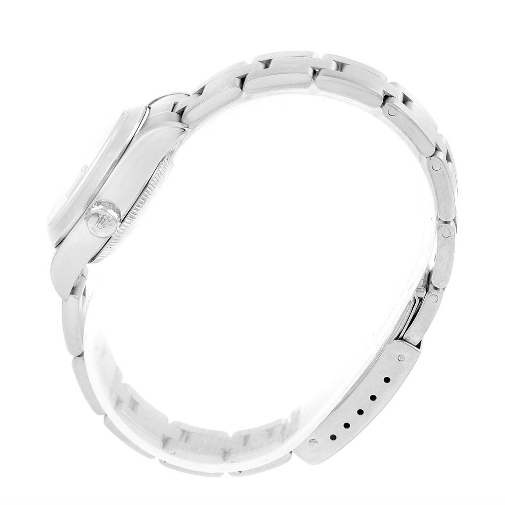 This side view of the Rolex Date 79160 Women's Stainless Steel Pink Dial 79160 Women's Stainless Steel Pink Dial model shows the band, case, and crown.