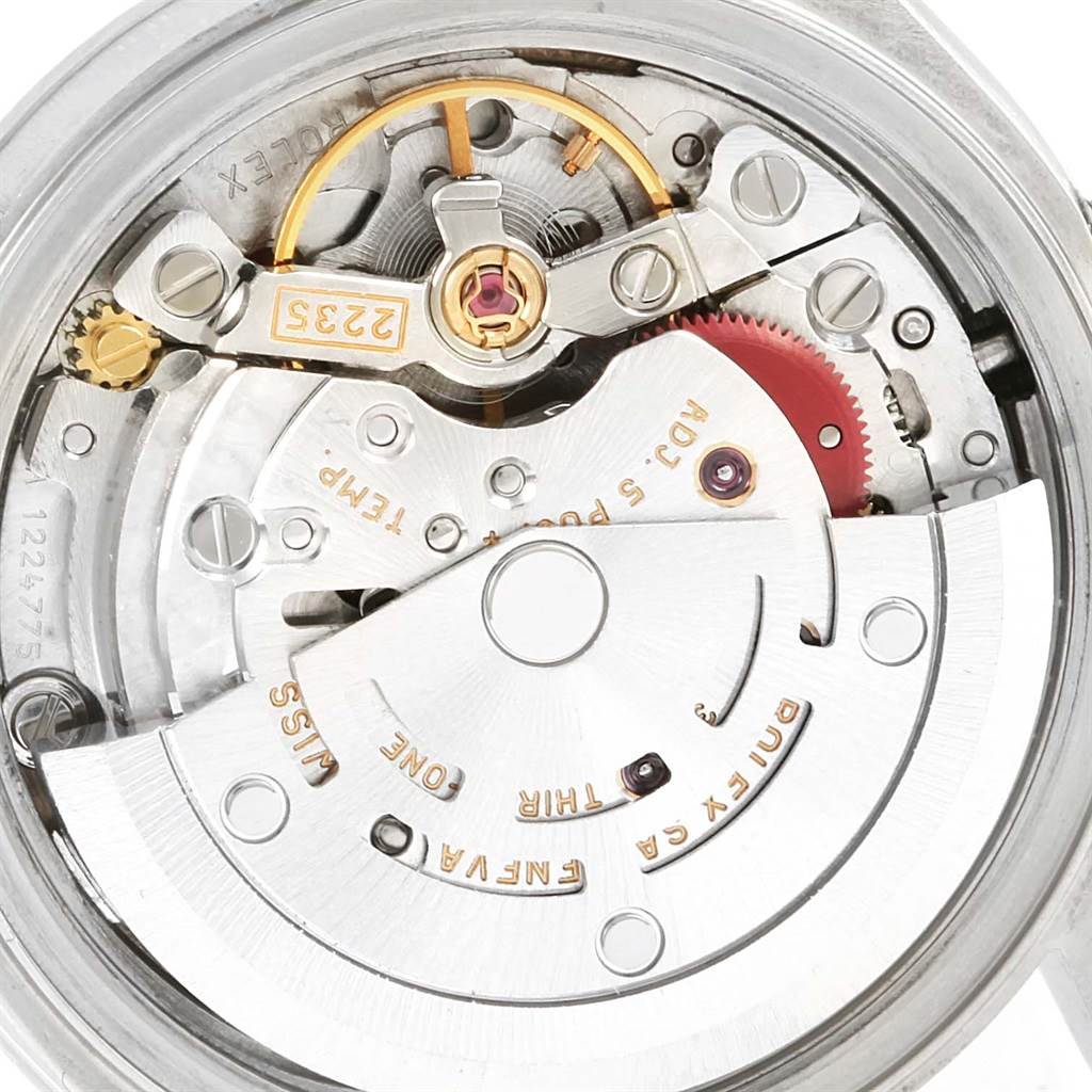 This is an internal view of a Rolex Date 79160 Women's Stainless Steel Pink Dial 79160 Women's Stainless Steel Pink Dial model watch showing the intricate movement and mechanical parts.