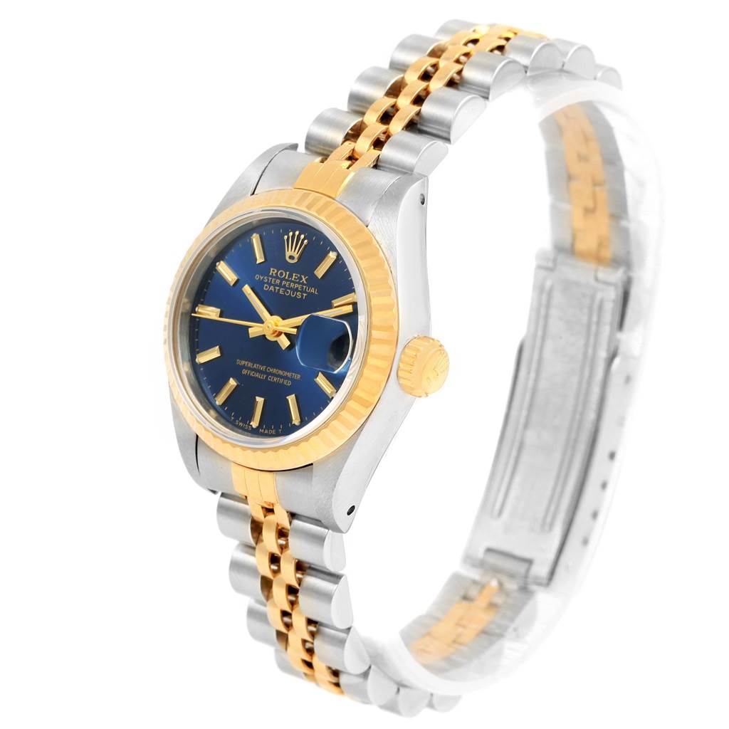 The Rolex Date 69173 Women's Stainless Steel Blue Dial 69173 Women's Stainless Steel Blue Dialjust watch is shown at an angled view, highlighting the blue dial, date window, gold bezel, and two-tone bracelet.