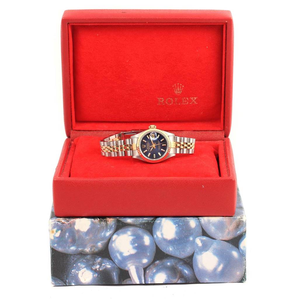 The Rolex Date 69173 Women's Stainless Steel Blue Dial 69173 Women's Stainless Steel Blue Dial watch is displayed face-up in its red box, showcasing the dial, bezel, and bracelet.